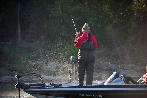 <p>
	Dodson brings the small bass to the boat.</p>

