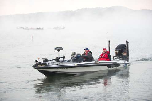 <p>
Rick Campbell loads his boat into the water. </p>