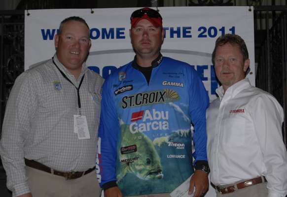 <p>
	Mark Pierce, center, took second place overall in the 2011 Bassmaster Federation Nation Championship presented by Yamaha and Skeeter. Jon Stewart, left, and Dave Ittner, right, honored him for this accomplishment.</p>
