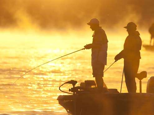 <p>
	Mike McClelland is surrounded by a golden sunrise on the final day of the Sooner Run on Grand Lake in 2006.</p>
