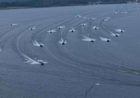 <p>
	Grand Lake lays out like a swollen river, forcing boats into the main river channel to get around,; this group of boats was following Mike McClelland in the main channel in 2006.</p>
