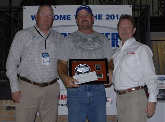 <p>
	Chris Price, center, won the title for the Mid-Atlantic Division. Jon Stewart, left, and Dave Ittner, right, presented him with his invitation to the 2012 Bassmaster Classic.</p>
