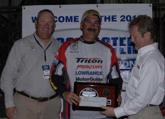 <p>
	John Diaco, center, won in the Eastern Division. Jon Stewart, left, and Dave Ittner, right, presented him with his plaque and invitation to the 2012 Bassmaster Classic.</p>
