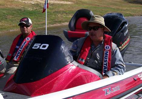 <p>
	Anglers wait patiently in their boats as they are pulled back to the boat yard.</p>
