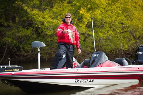 <p>
	Todd Serfoss holds his fish up for the cameras. </p>

