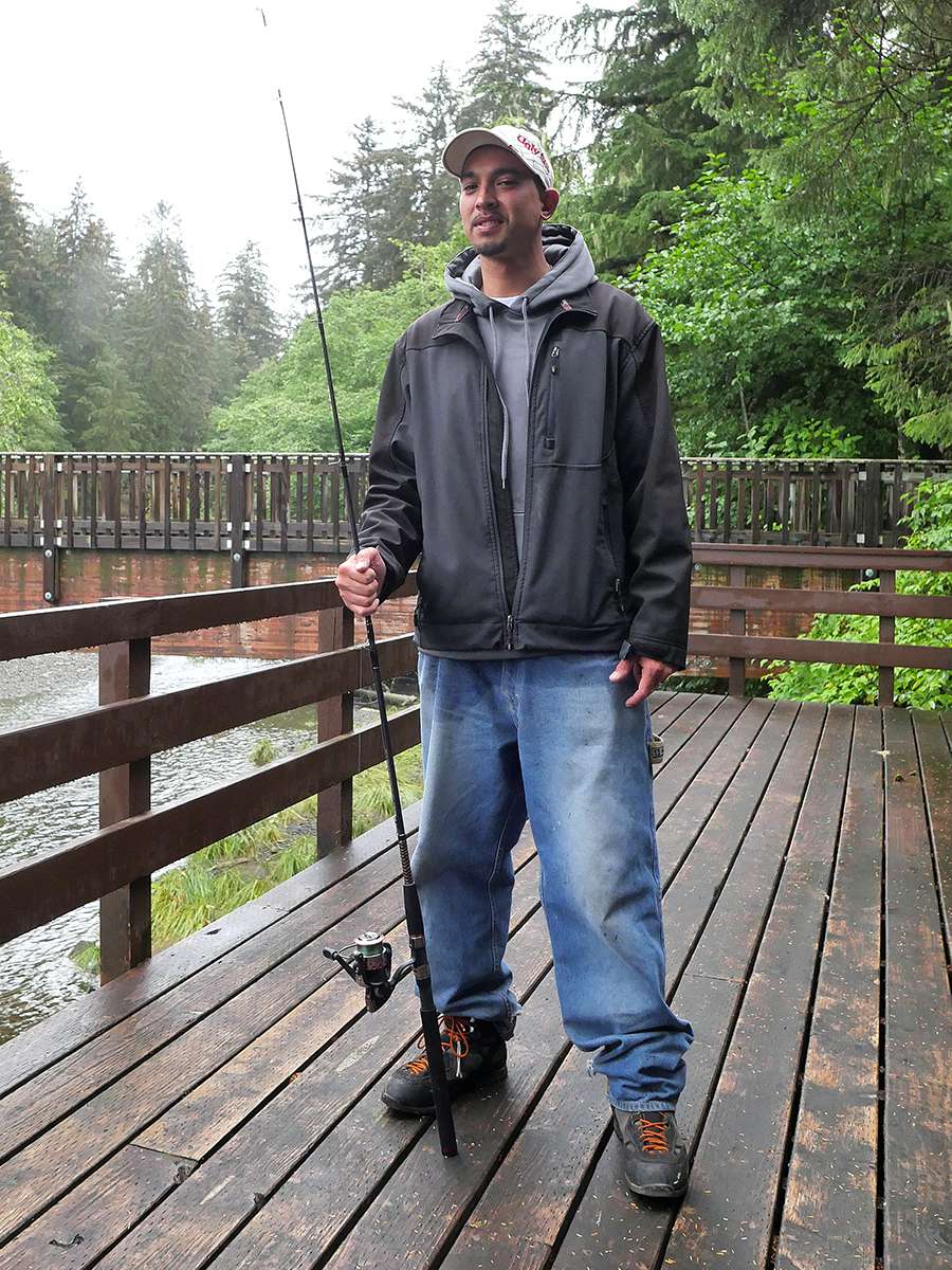 Grand Prize winner Chris Pascua posing with an Ugly Stik GX2 and getting ready to fish.