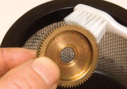 Scrub gears and other parts with a toothbrush.