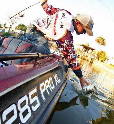 <p>
	Rejzer moves his hand to intercept the largemouth, but the bass has other ideas.</p>
