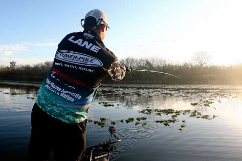 <p>
	Lane fires his first cast of the day along an edge in the lily pads.</p>
