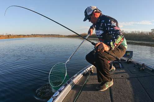 <p>
	Lane readies the net to scoop up his first keeper of the morning.</p>

