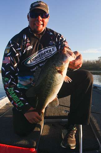 <p>
	Lane shows off his first keeper of the morning, a solid Harris Chain bass.</p>
