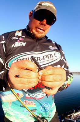 <p>
	Lane rigs up a black Sweebo worm on the final day, a key bait and color. âThe fish were biting that color all week,â Lane said. âI pay attention to what the co-angler in the back is doing. They werenât catching them. The fish were really keyed into the specific presentation I had.â</p>
