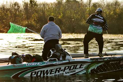 <p>
	Chris Lane hooks up again early and Bill Capps readies the net.</p>
