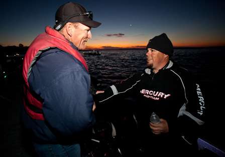 <p>
	Tim Frederick and Chris Lane shake hands has they wait for the day to begin.</p>
