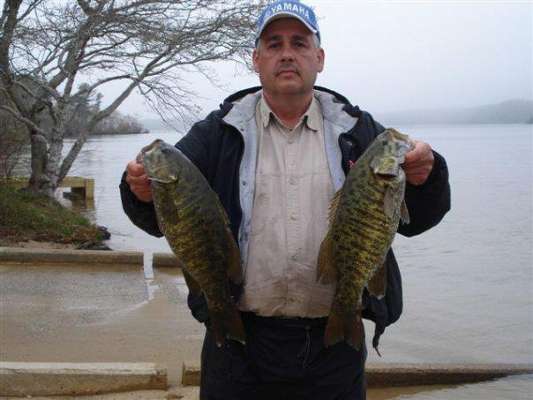 <p>
	William Wright Jr. holds up two nice smallmouth. Want to take a stab at their weight?</p>
