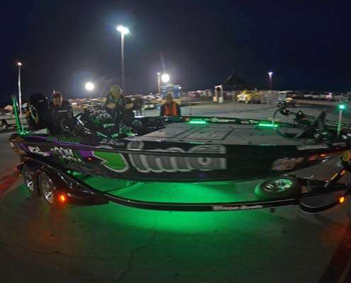 <p>
	Fred Roumbanisâ boat casts an eerie green glow as it goes through the launch line.</p>
