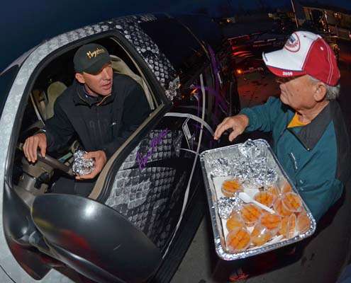<p>
	Aaron Martens takes delivery of biscuits and orange juice for breakfast while he waits to launch.</p>
