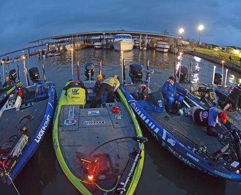 <p>
	Competitors in the 2012 Bassmaster Classic line the dock waiting for the start of Practice Day.</p>
