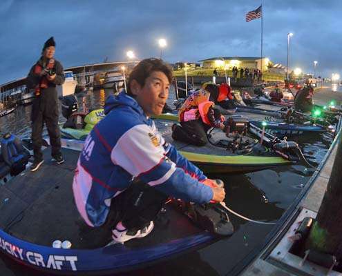<p>
	Takahiro Omori listens to the tournament crew as he ties his boat to the dock Wednesday morning.</p>
