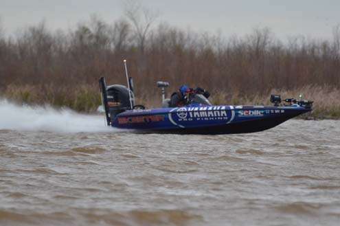 <p>
	Todd Faircloth speeds through a backewater area on Friday, Day One of the Bassmaster Classic.</p>

