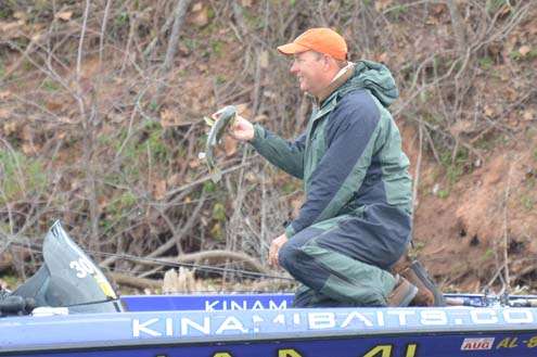 <p>
	Steve Kennedy holds up a small keeper Friday morning.</p>
