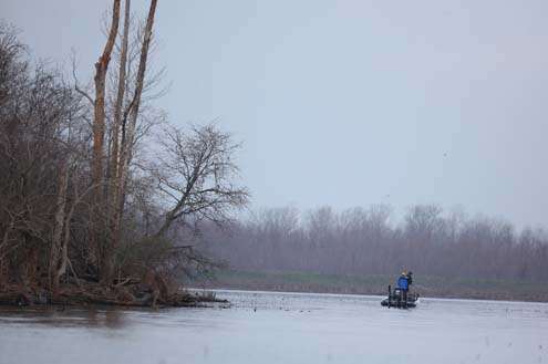 <p>
	Terry Scroggins is dwarfed by the landscape of the Red River. The cloudy day and lack of leaves gives a cold feel to things.</p>
