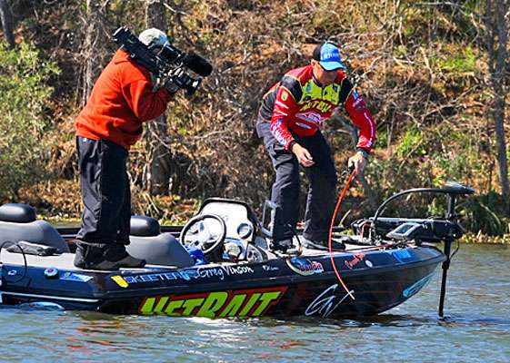 With a better fish on the line, Vinson cautiously plays it to the side of the boat.