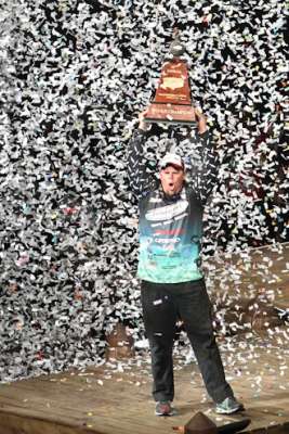 <p>
	Lane holds the trophy overhead and enjoys the moment.</p>
