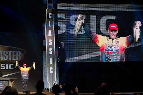 Keith Combs shows off two big bass from Saturday's competition.