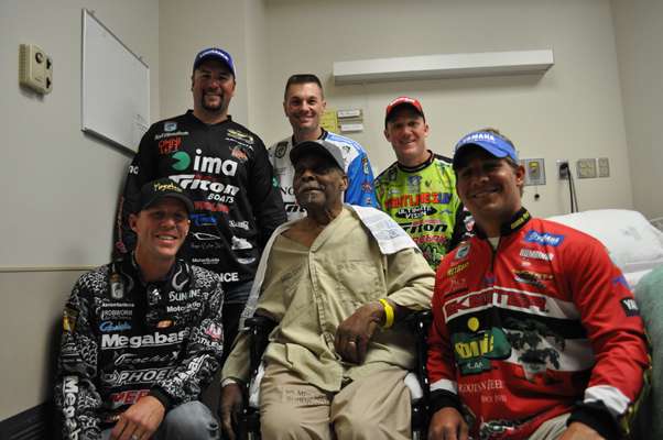 <p>
	Merchant Marine veteran Herman Presley, 87, is surrounded by well-wishing Classic competitors.</p>
