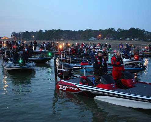 <p>
	Anglers pay tribute to the flag at the playing of the National Anthem.</p>
