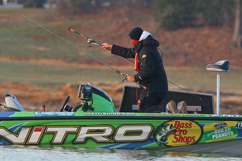 <p>
	Joey Nania pulls rods from the rod locker to begin his Day One on Lewisville Lake. </p>

