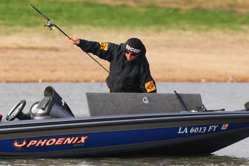 <p>
	Darold Gleason had one fish in the livewell early on Day One; he reaches in his rod locker for a different bait selection. </p>
