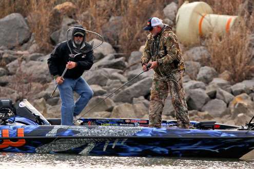<p>
	Biffle fights a fish to the boat while his co-angler grabs the net. </p>
