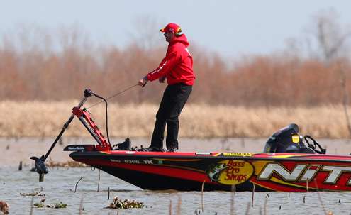 Kevin VanDam drops his trolling motor to explore an area off the main river channel. 
