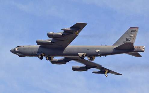 A B-52 bomber from nearby Barksdale Air Force Base flies across the Red River during the practice period.
