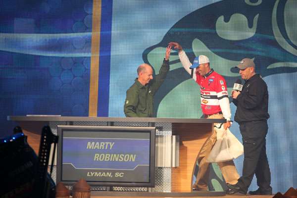<p>
	 </p>
<p>
	Trip Weldon and Dave Mercer greeted the angler onstage as the crowds cheered.</p>
