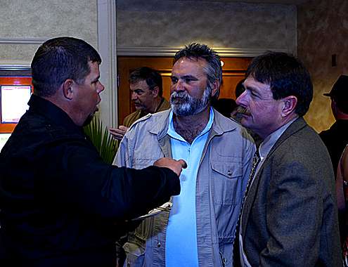 <p>
	Chris Lane (left) and Shaw Grigsby (right) talk with Bassmaster photographer James Overstreet.</p>
