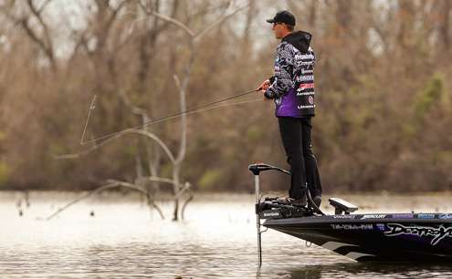 <p>
	Martens takes a perch on his trolling motor bracket to get a better view of the stumps he was casting to. </p>
