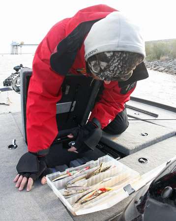 <p>
	Josh Bertrand rummages through his jerkbait box, looking for a change of lures.</p>
