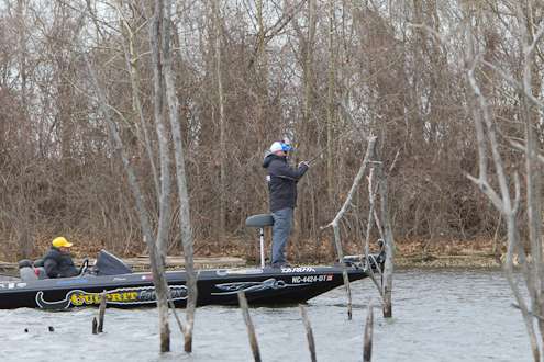 <p>
	Dustin Wilks fishes through some timber on Friday.</p>
