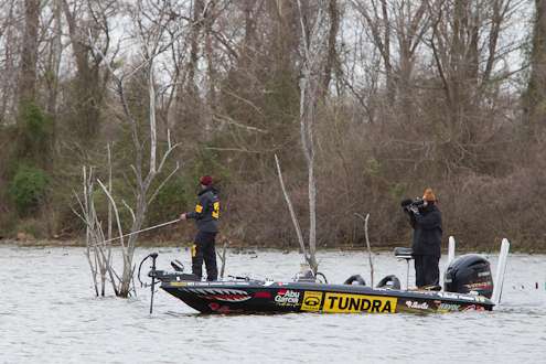 <p>
	Mike Iaconelli fishes some shallow structure on Friday.</p>
