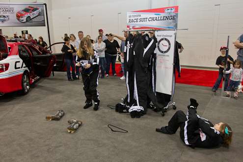 <p>
	Two female fans participate in the Toyota Race Suite Challenge.</p>
