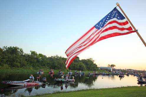 <p>
	The American flag waves as the national anthem is sung.</p>
