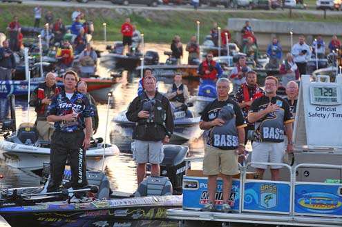 <p>
	B.A.S.S. staff and anglers stand at attention for the national anthem.</p>
