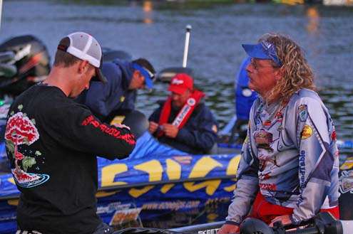 <p>
	John Crews and Brent Broderick visit prior to the start of Day One.</p>
