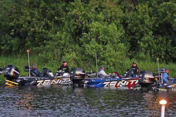 <p>
	On the opposite bank, anglers get their gear ready.</p>
