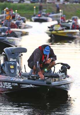 <p>
	Jared Lintner works on his electronics before the take-off Thursday.</p>
