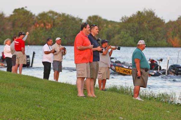 <p>
	Spectators watch as the boats leave the staging area and idle into the Kissimmee River.</p>
