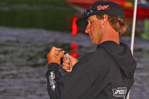 <p>
	 </p>
<p>
	Fletcher Shryock makes some adjustments to his baits prior to the take-off.</p>
